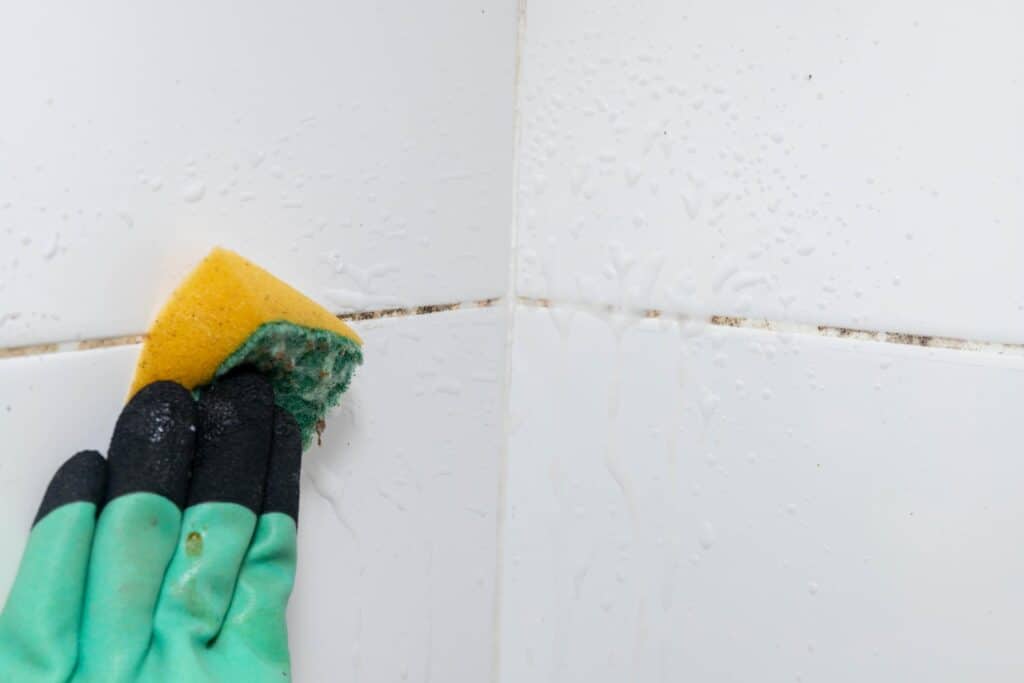Deep house cleaning service in Canton MA scrubbing bathroom and removing buildup